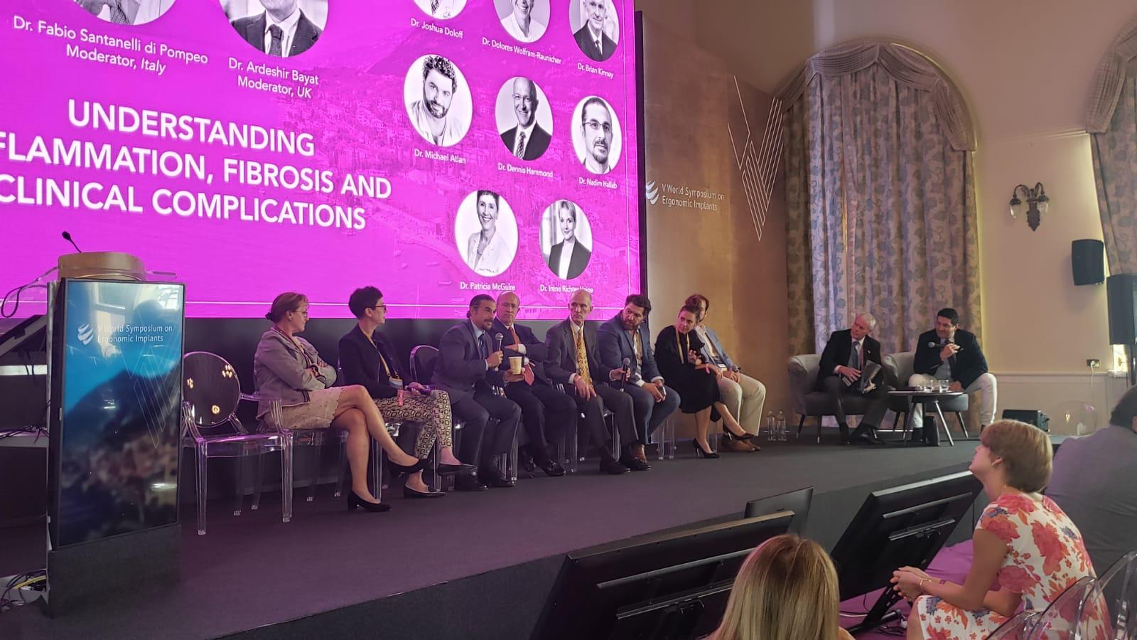 Speakers on the stage at 5th V World Symposium 